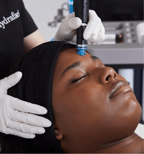 A woman closing her eyes for Hydrafacial treatment